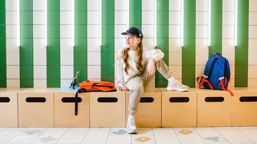 Elementary School student sitting on bench